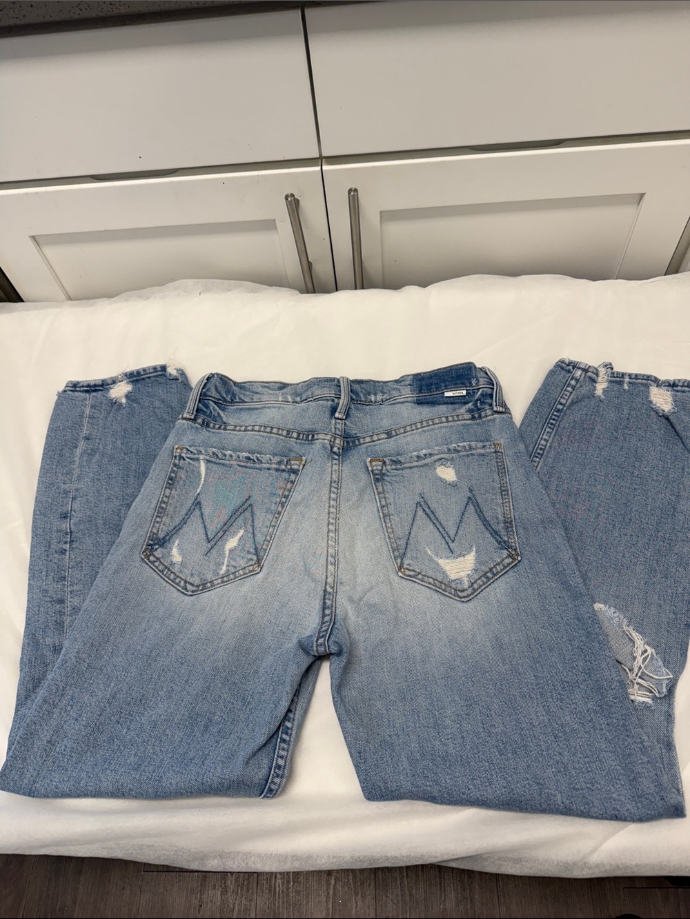 MOTHER Light Blue Distressed Boyfriend Jeans with Signature Back Pocket M-Stitch